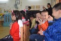 CANTON, CHINA Ã¢â¬â CIRCA MARCH 2019: Smiling boys watching performance of their classmates in kindergarten.